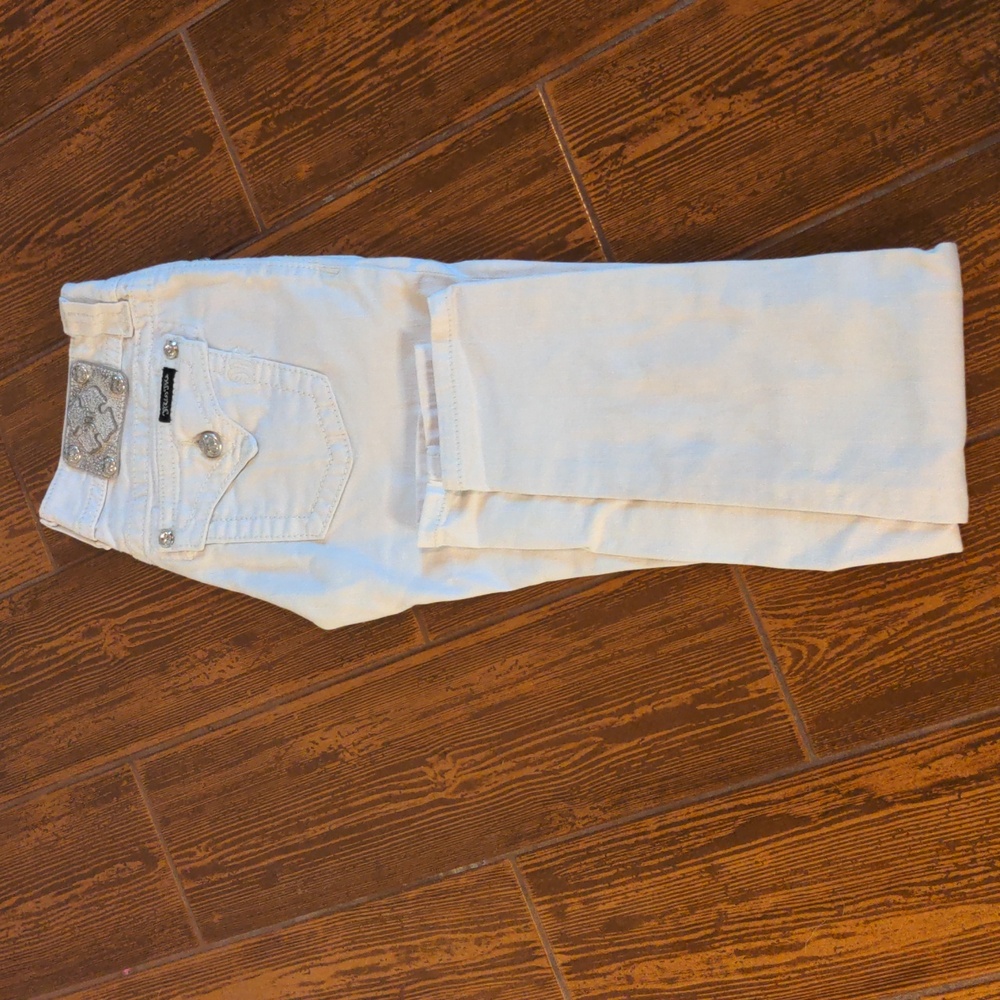 Miss Me white boot cut jeans with jeweled embellishment on the pockets